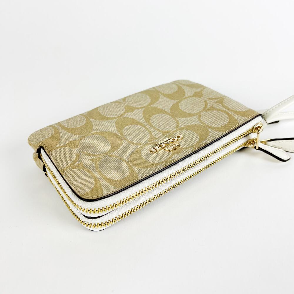 NWT Coach signature PVC double corner zip wristlet light khaki chalk white